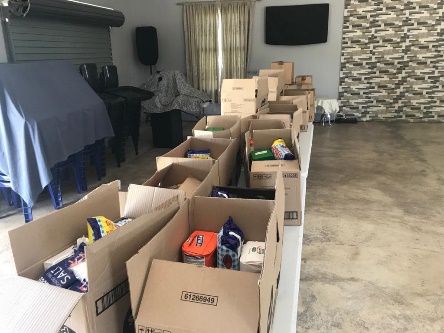 Boxes of groceries packed for weekly distribution to partner organisations
